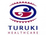 An image of the Turuki Healthcare logo. It has a Māori symbol above the organisation name. The logo is dark blue and maroon.